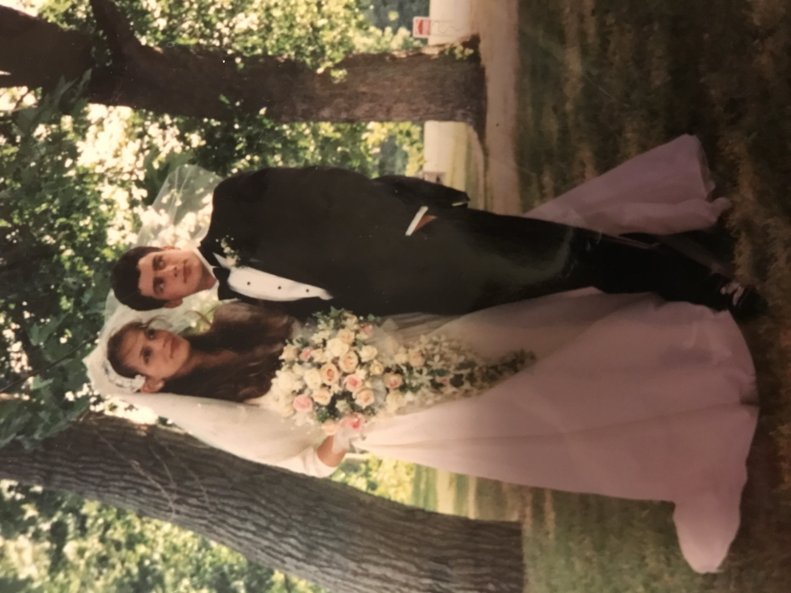 Mary and Dan on their wedding day, with Mary wearing her mother’s dress.